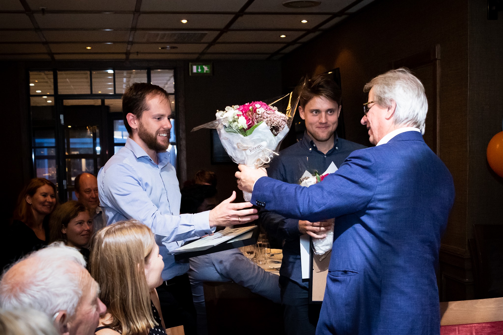 Sepp de Raedt and Ole Johan Skrede receiving the ICGI Development Prize 2019 from Håvard E. Danielsen